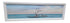 SHL panoramic coastal driftwood wall art featuring weathered tree branches in blue ocean water with white frame measuring 81.5 x 24.5 used in good condition
