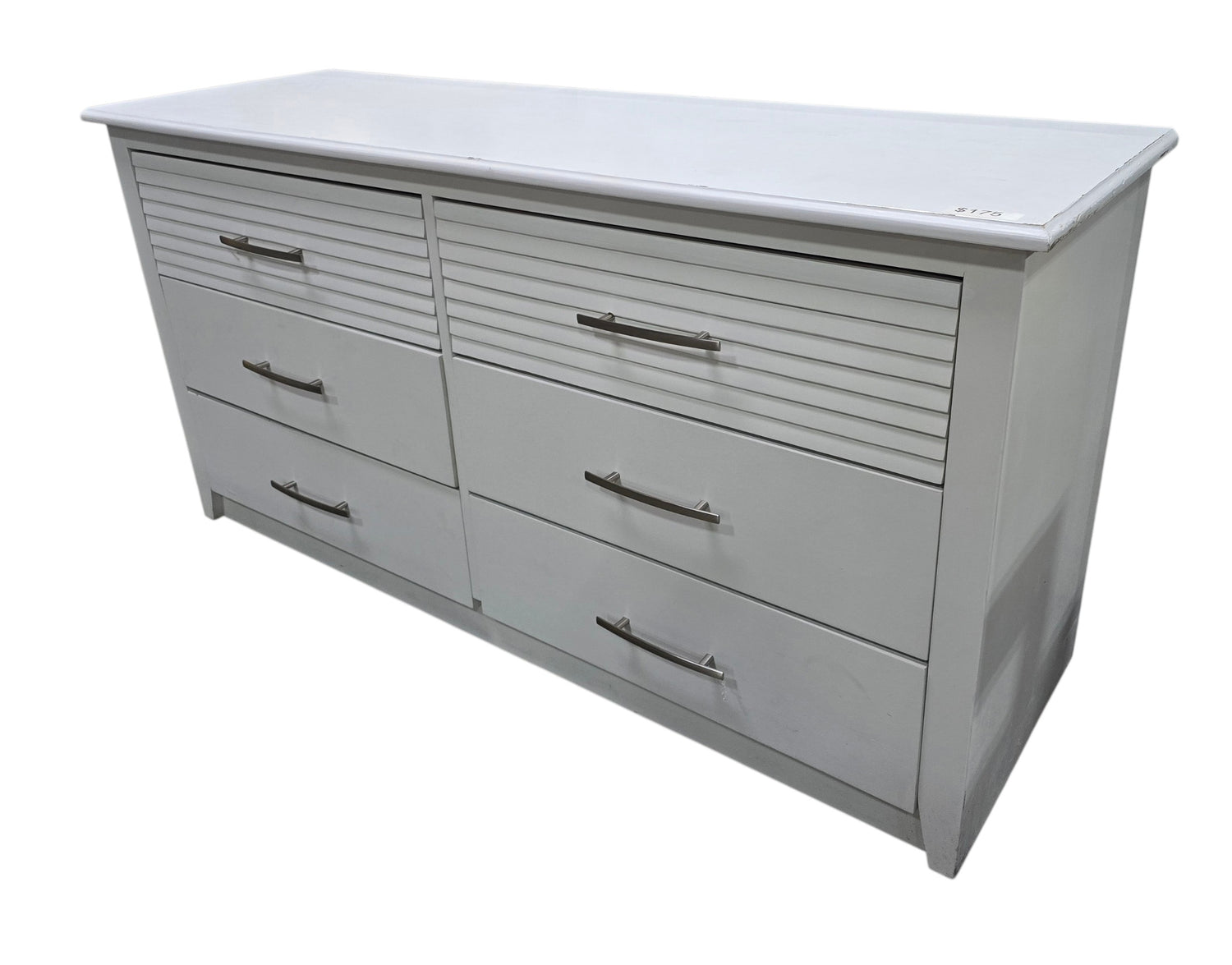 SHL white six drawer dresser measuring 60 x 19.5 x 30 inches shown from angled view with decorative drawer detailing