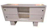 Used, white TV stand with sliding doors located in Cartersville, Ga. 