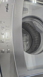 Modern Whirlpool stacked washer dryer combo with transparent washer lid