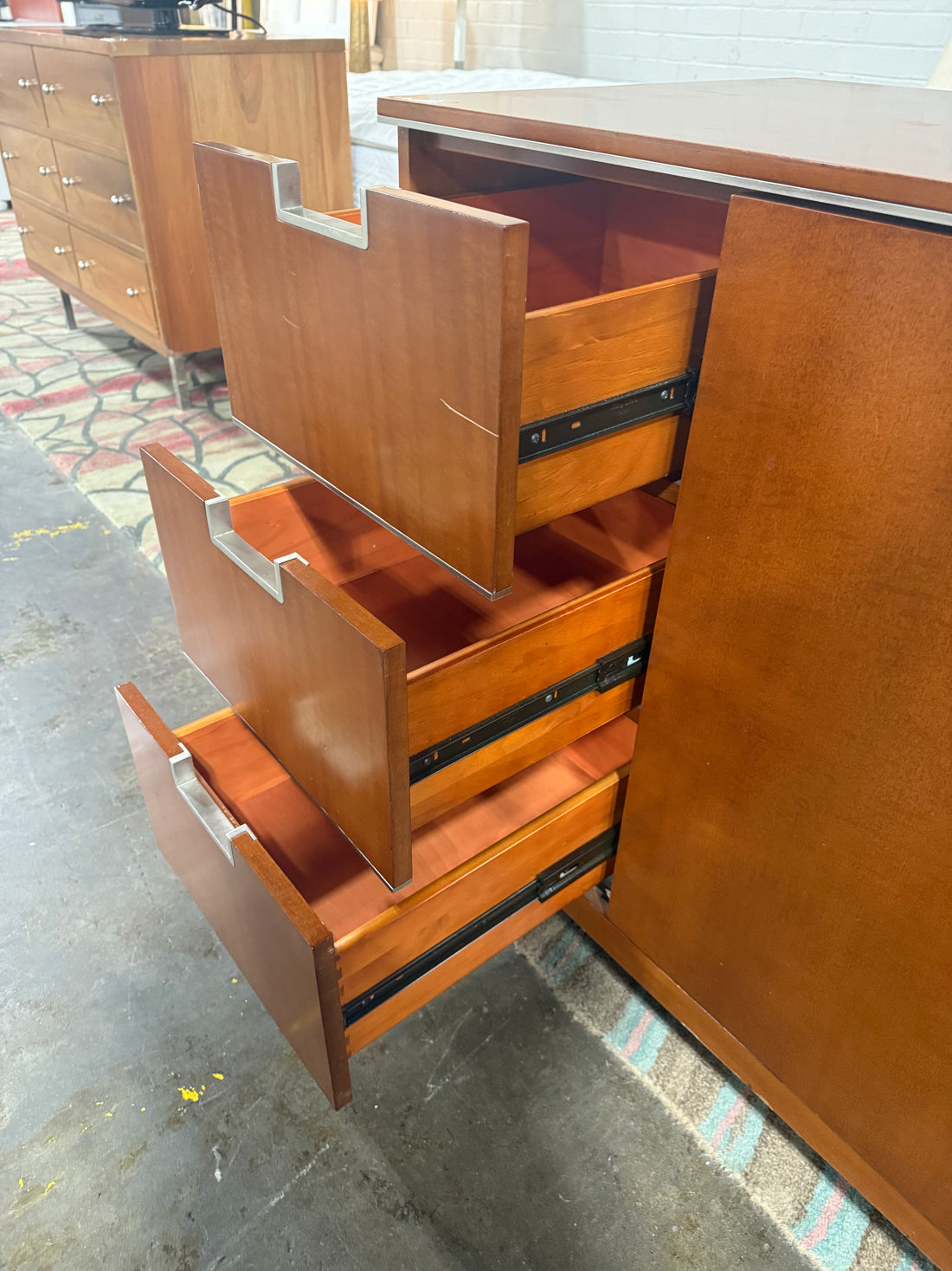 Close-up of Fairmont Designs dresser drawers highlighting smooth glides and sturdy wood craftsmanship.