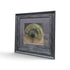 Framed abstract artwork with olive green circular woodgrain design and dark rustic frame