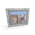 Framed coastal beach photograph with dune fence flip flops ocean and distressed white frame