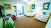 Grand Palms double room furniture set – two beds, dresser, nightstands, mirror, lamps, and artwork from hotel liquidation