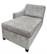 Front view of grey velvet chaise lounge with upholstered velvet fabric and modern silhouette.