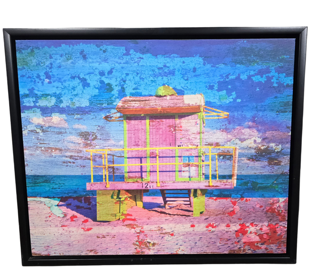 24 x 20 lifeguard hut canvas wall art with black frame. Coastal-inspired artwork for living rooms, rentals, or hotel spaces.