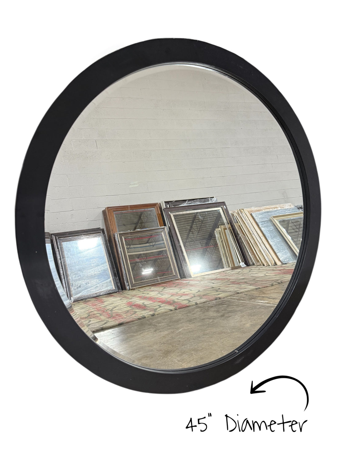 Modern black round mirror, 45 inch diameter, decorative wall décor, available at Southern Hospitality Liquidation Cartersville GA