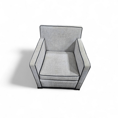 “Modern gray arm chair with black trim – used in good condition, perfect for living or office space”