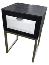 Modern nightstand with black granite top and single drawer, silver base, available from SHL Cartersville GA