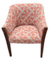 Front view of orange and beige bucket chair, modern accent seating from SHL, used and in good condition