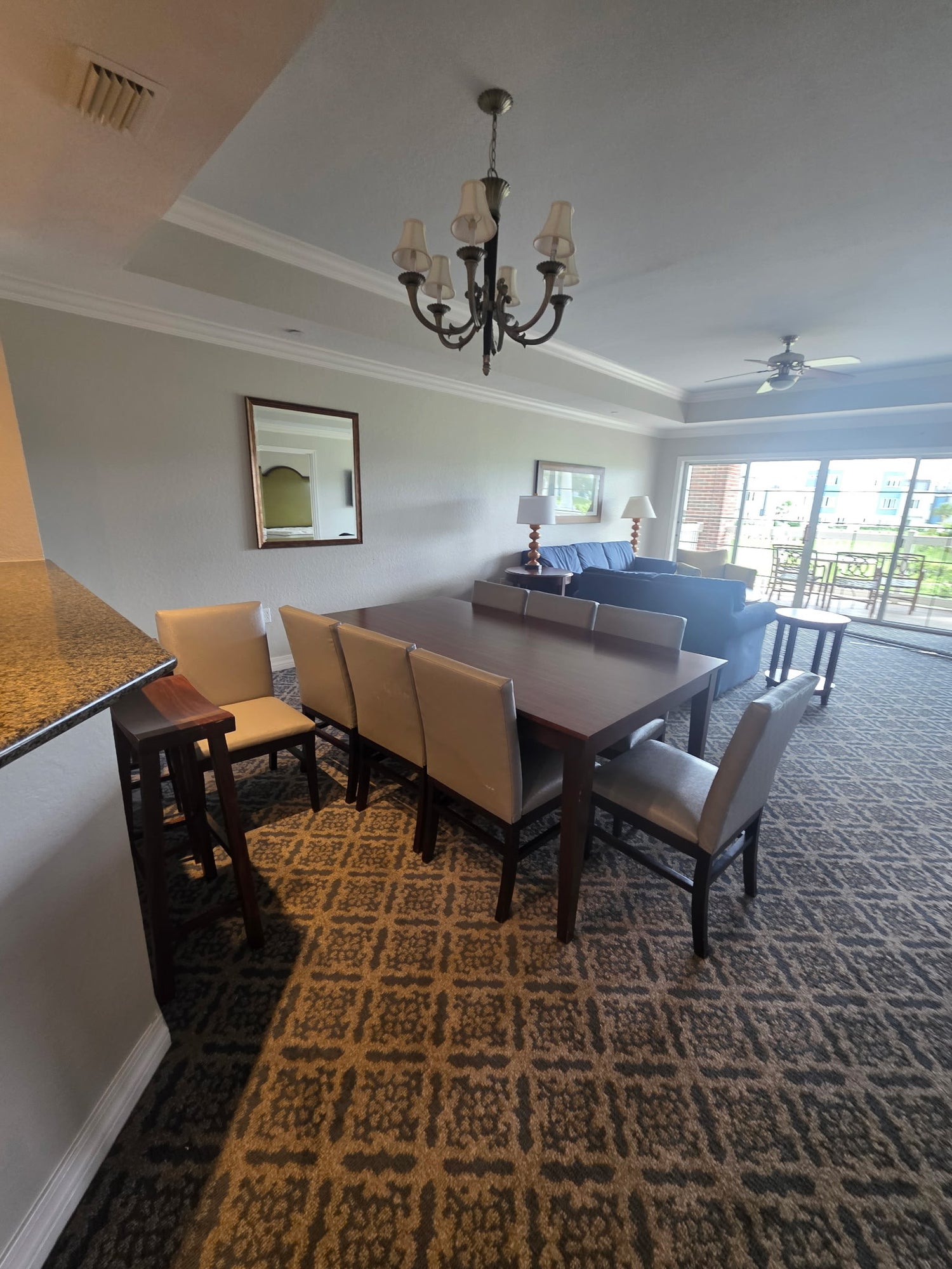 Reunion Resort dining room package includes 8-top dining table, chairs, sideboard, bar stools and artwork
