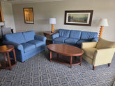 Reunion Resort living room package with queen sleeper sofa, loveseat, accent chair, tables and lamps
