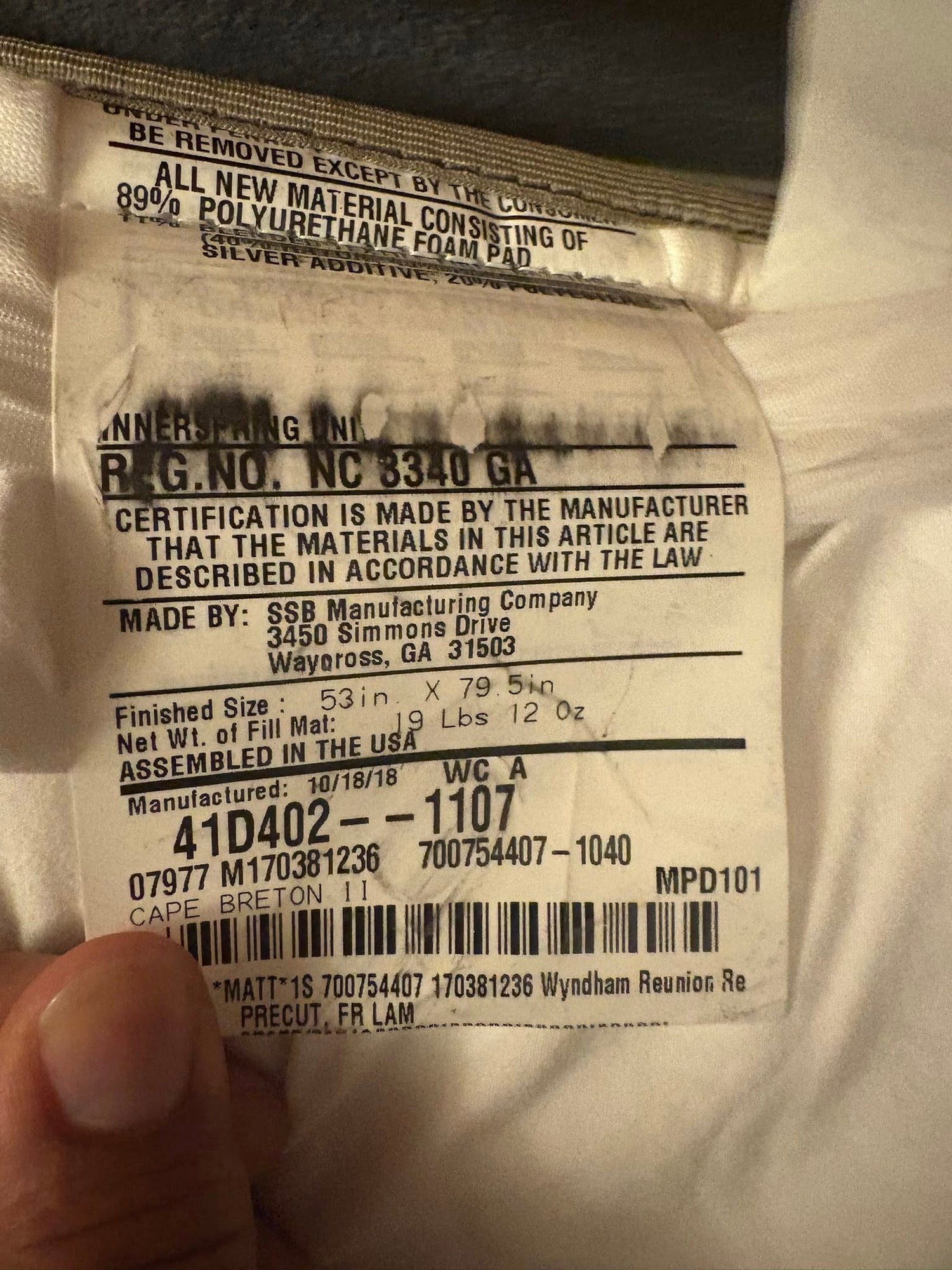 Reunion Resort mattress tag showing 2018 model details from hotel liquidation furniture package