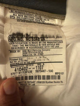 Reunion Resort mattress tag showing 2018 model details from hotel liquidation furniture package