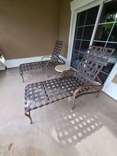 Reunion Resort patio furniture package with two lounge chairs, dining table, four dining chairs and tea table