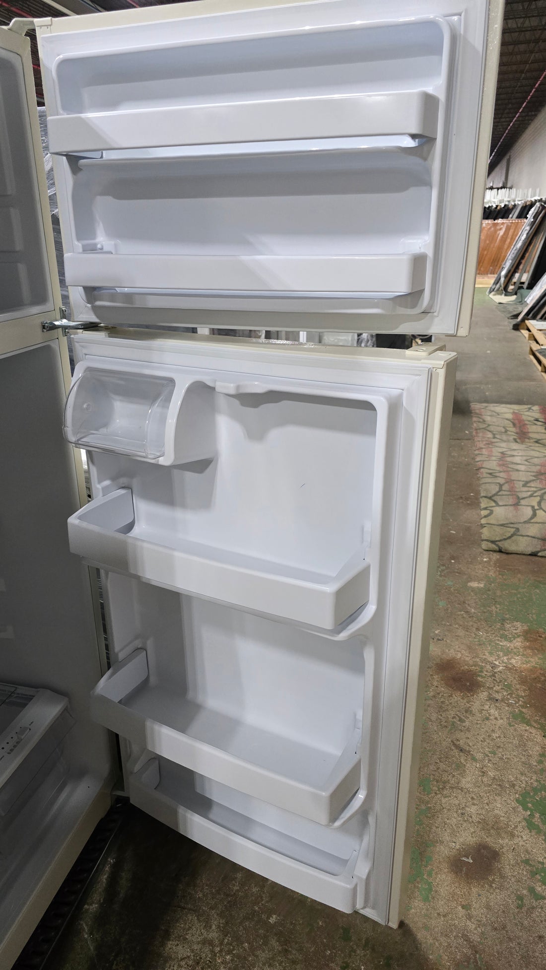 SHL side view of off-white GE 17.5 cu. ft. top-freezer refrigerator, gently used and in very good condition