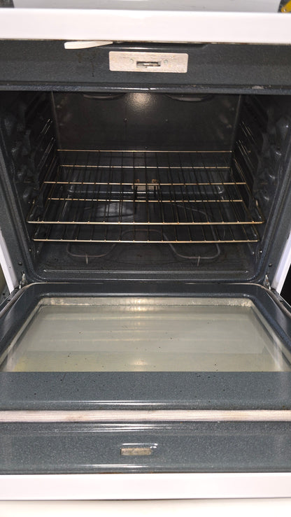 Interior oven view of GE 30-inch glass top stove showing racks and spacious design from SHL