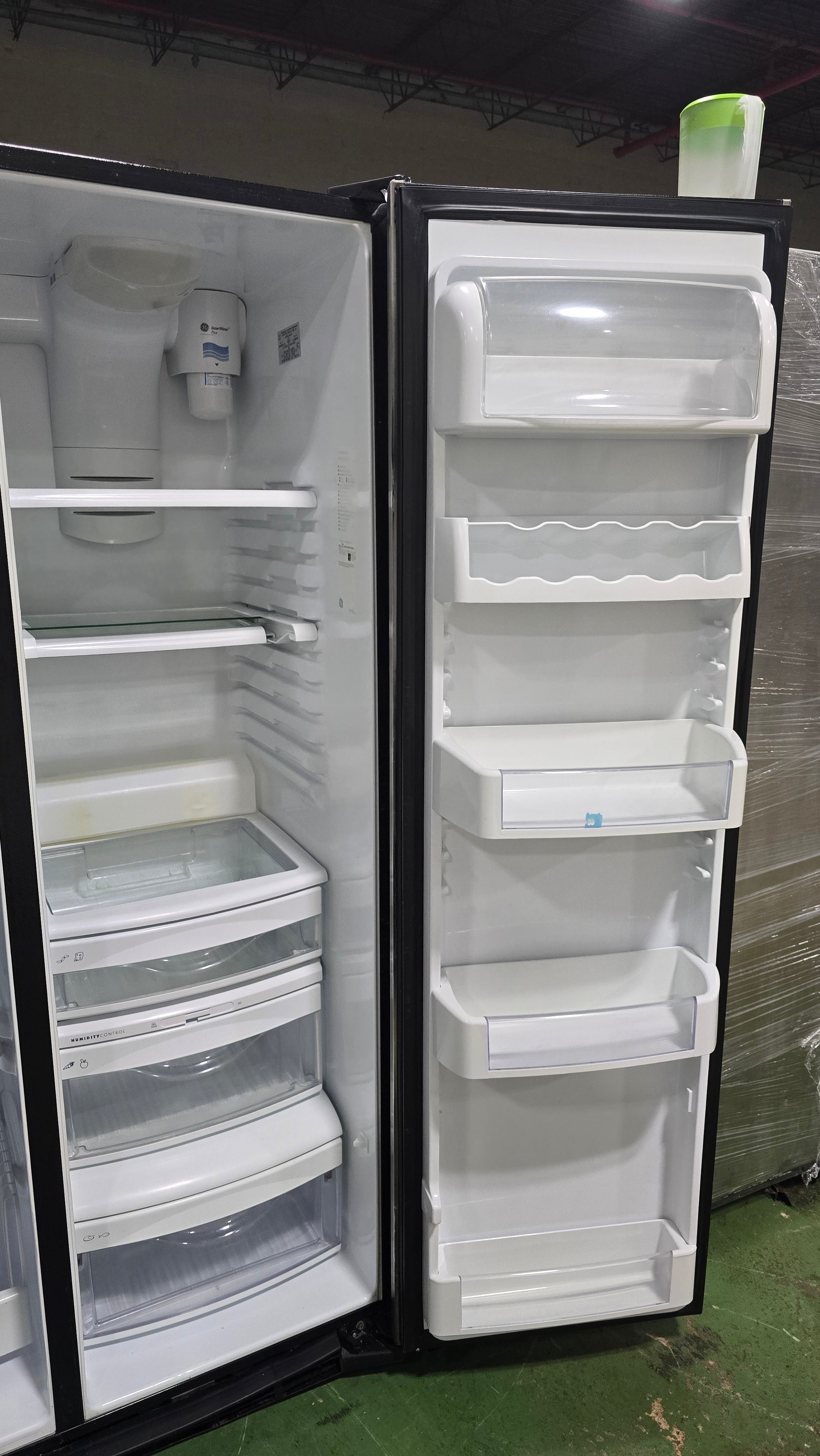 SHL GE side-by-side refrigerator/freezer with doors open, used and in good condition