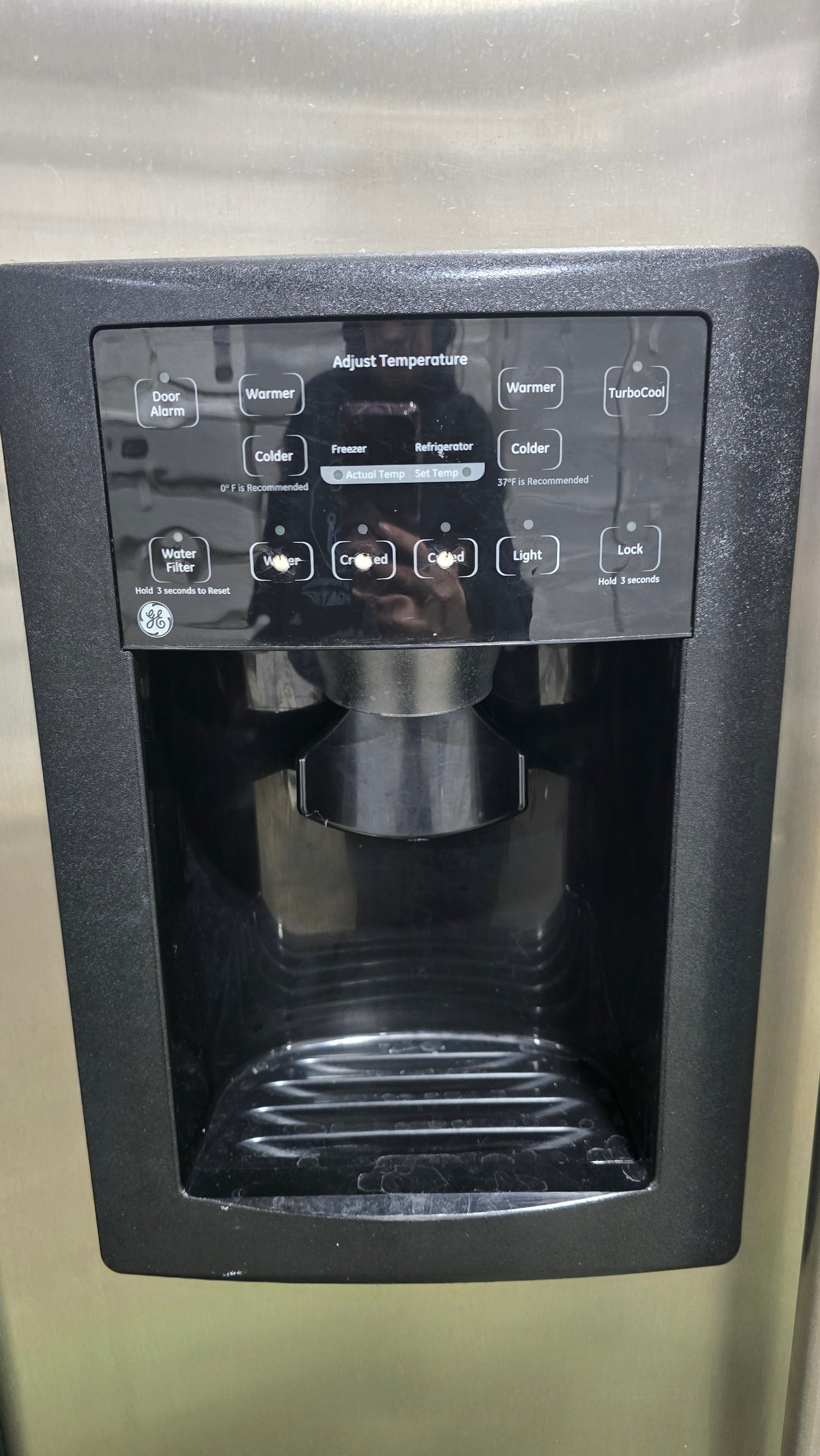 SHL handle detail of GE side-by-side refrigerator/freezer, used and in good condition