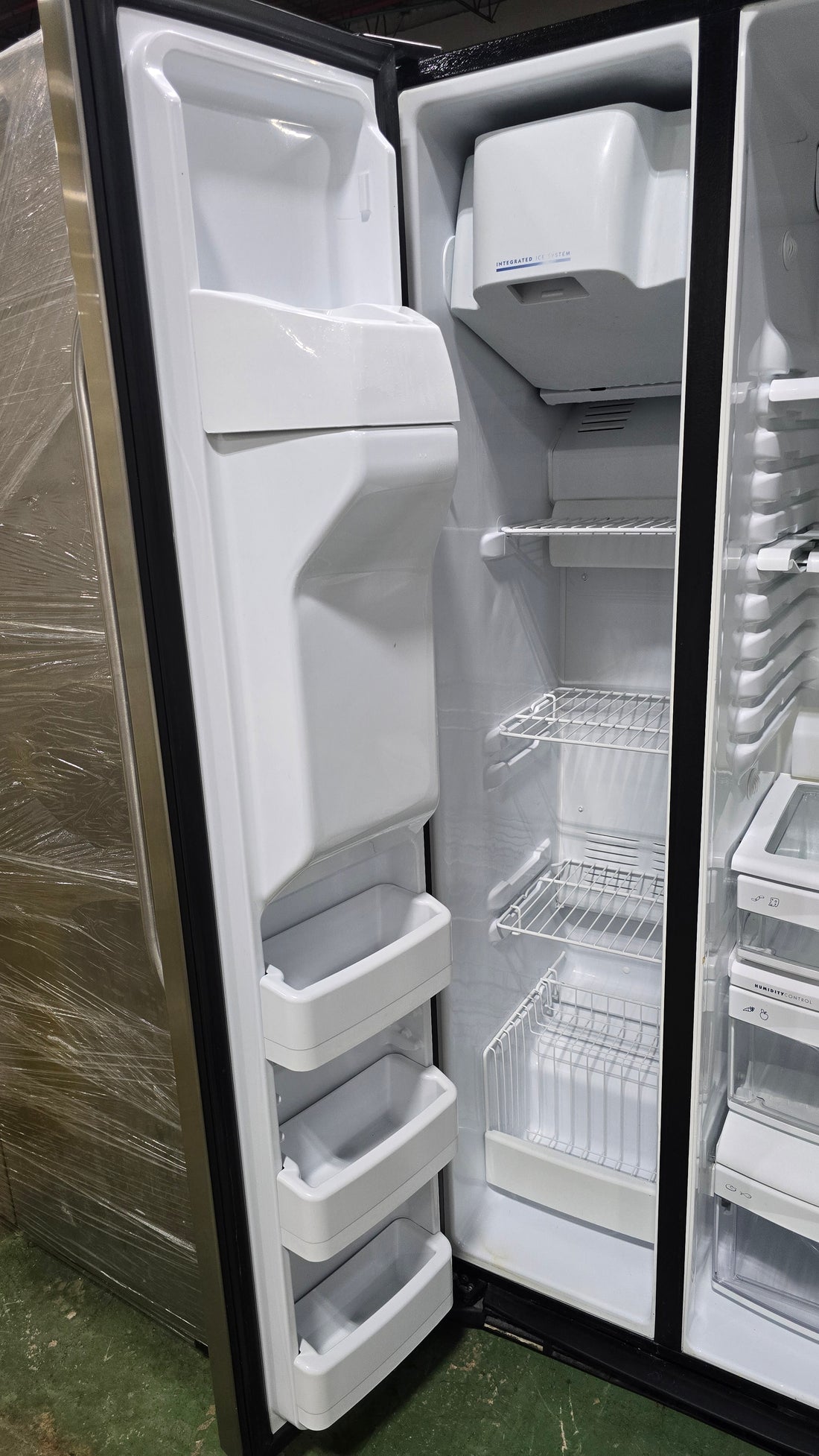 SHL interior of GE side-by-side refrigerator/freezer, used and in good condition