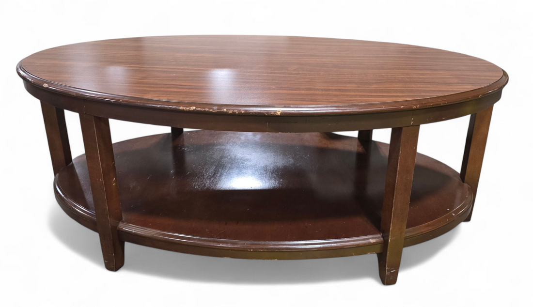 Southern Hospitality Liquidation wooden coffee table with oval design – quality used resort furniture