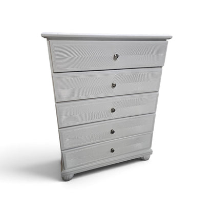 Used white five-drawer chest with decorative wave-pattern fronts, SHL.