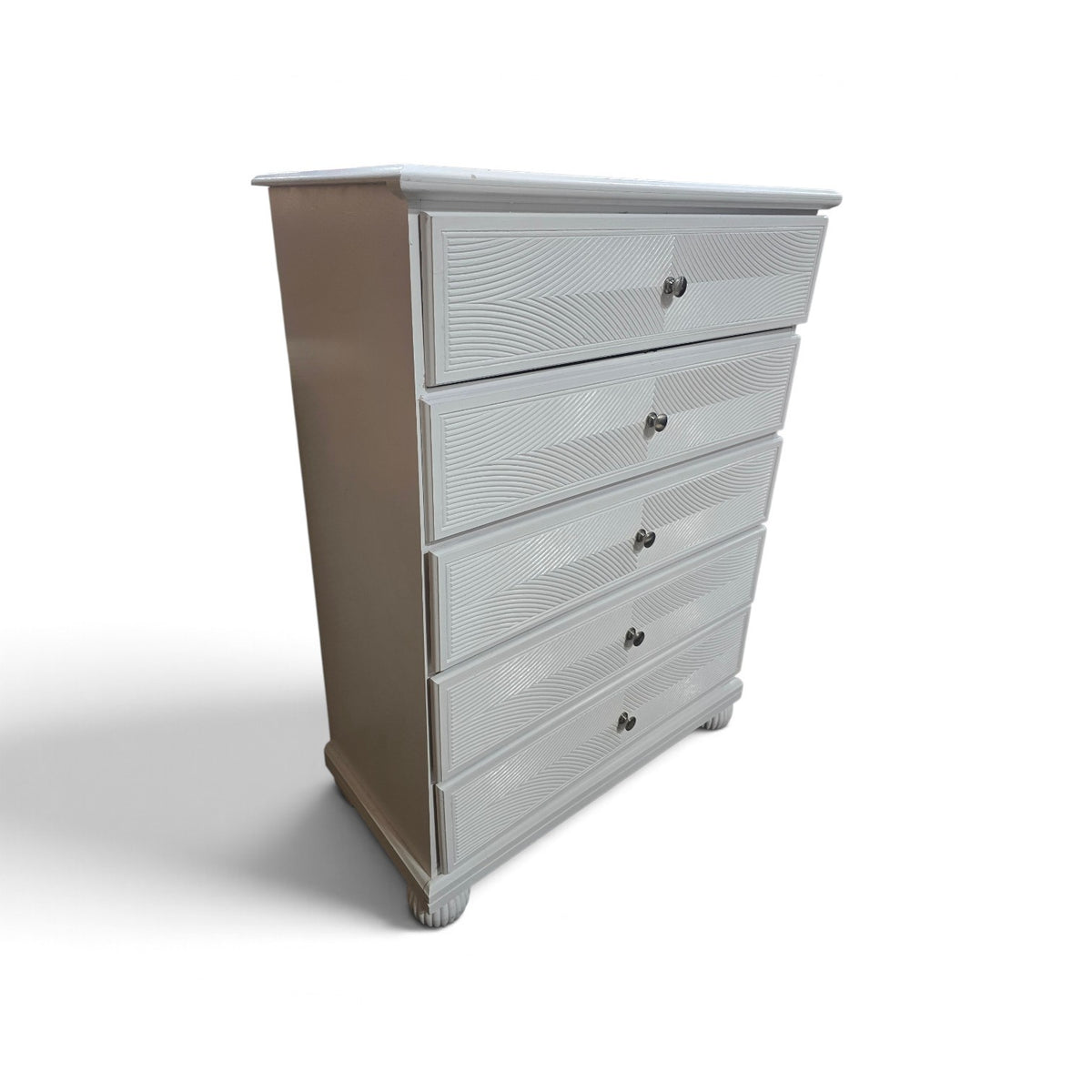 Side view of used white five-drawer chest with dark brown sides, SHL.