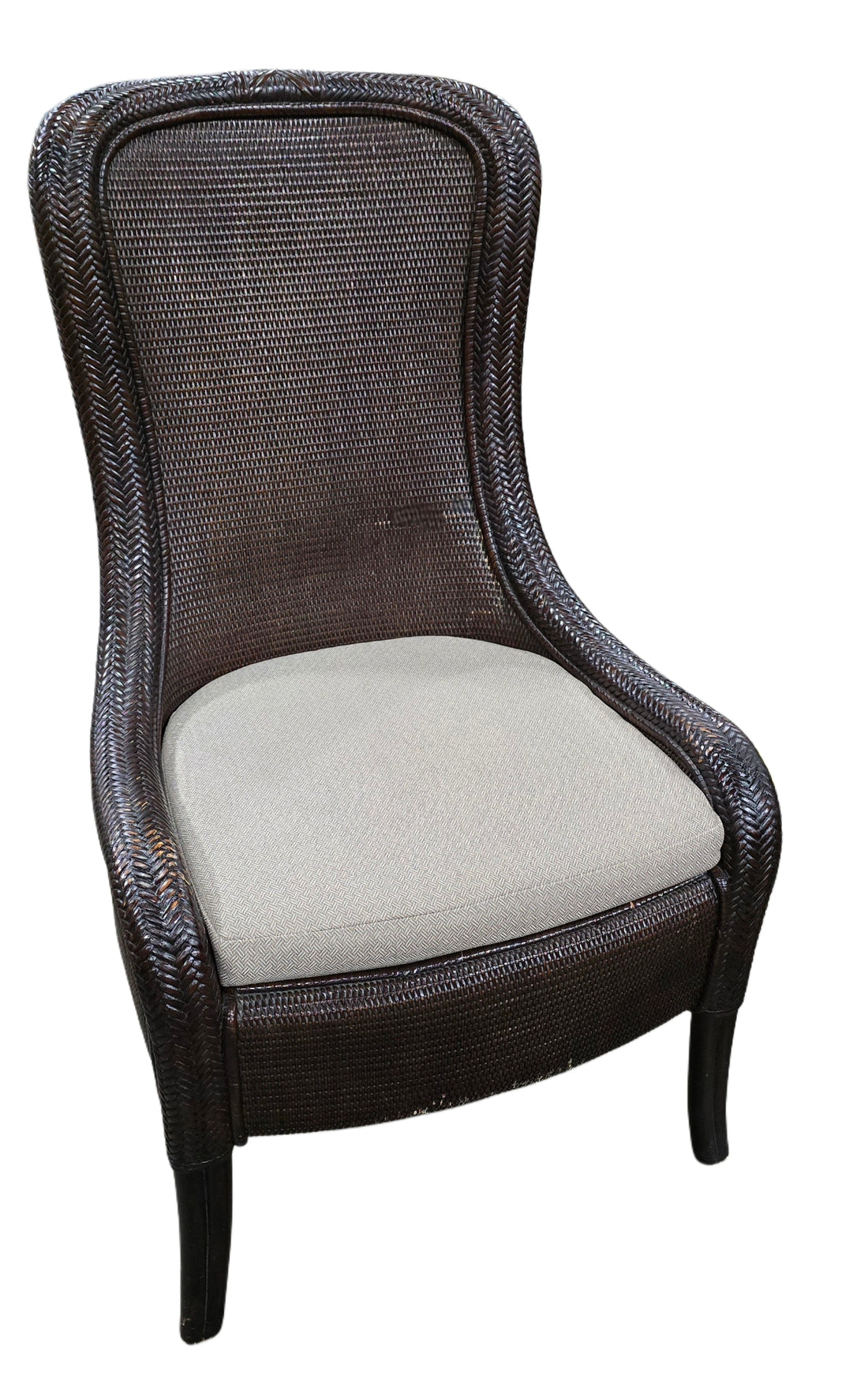 Front view of Tommy Bahama wicker chair with beige upholstered seat, used and in good condition