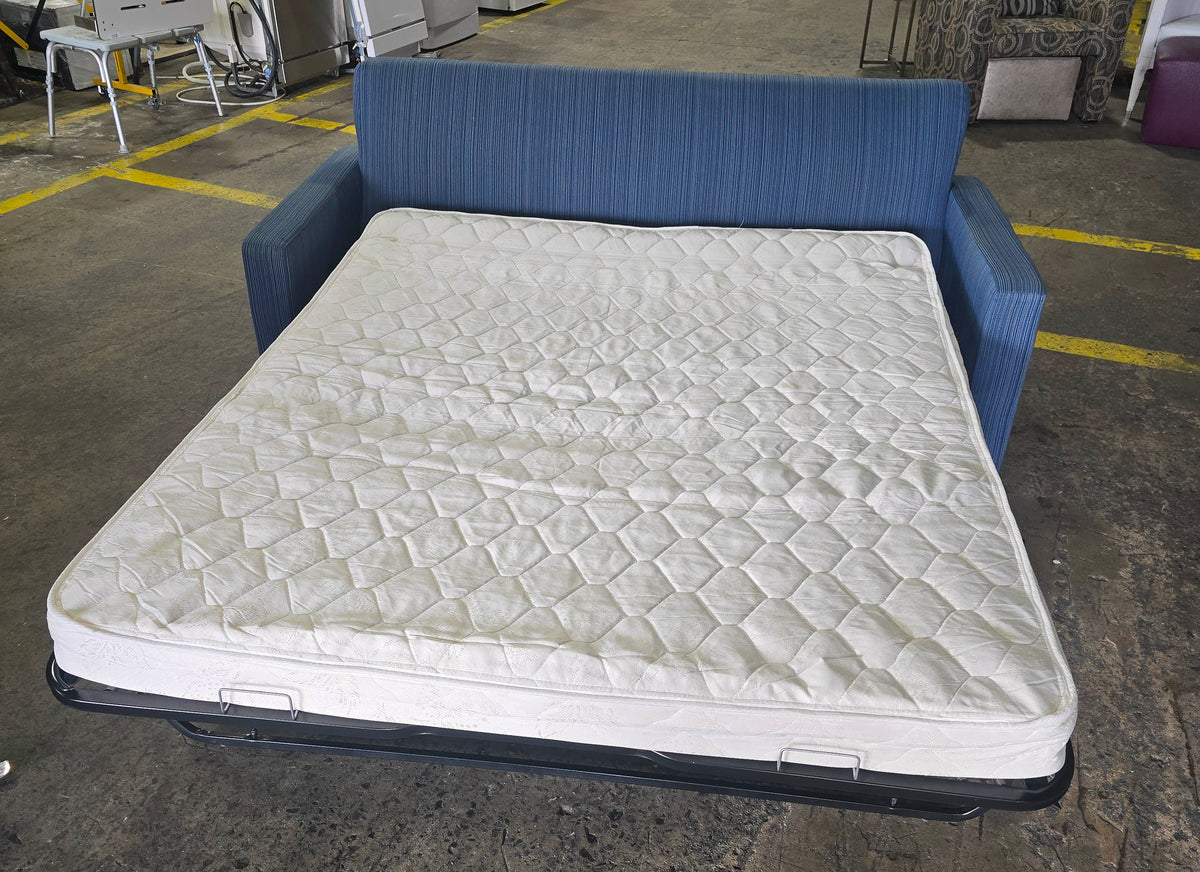 Used blue queen sofa sleeper opened to show included queen-size mattress, SHL