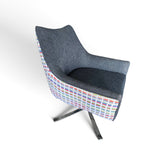 Used gray accent chair showing colorful geometric patterned back and polished metal base, SHL