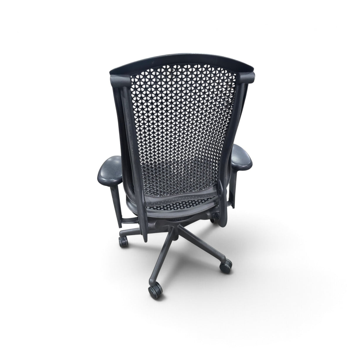 Used black Herman Miller office chair showing woven-style back, rear frame and five-star rolling base, SHL
