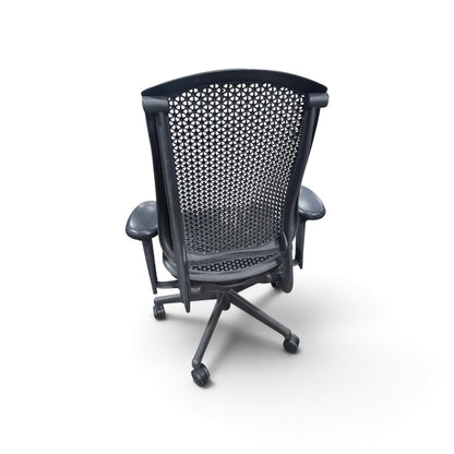 Used black Herman Miller office chair showing woven-style back, rear frame and five-star rolling base, SHL