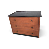 Used 3 drawer dresser with warm wood finish, black granite top, and black square drawer pulls from Southern Hospitality Liquidation.
