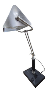 Used adjustable metal desk lamp with articulated arm and built-in power outlet from Southern Hospitality Liquidation.