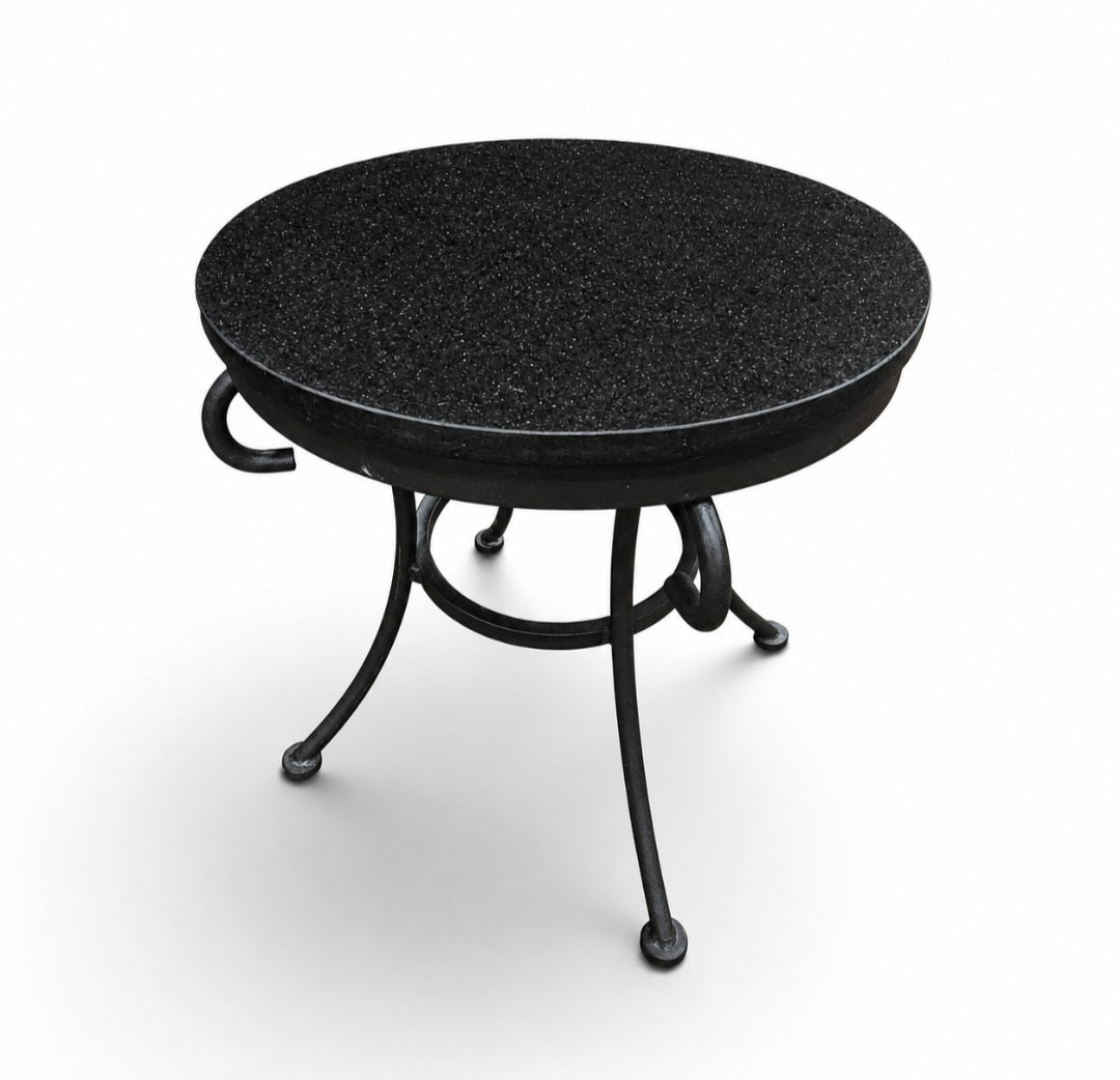 Used black granite top side table with decorative black metal base from Southern Hospitality Liquidation.
