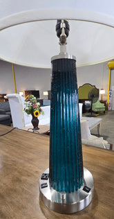Close-up of used blue ribbed glass table lamp featuring built-in USB ports and dual power outlets, sourced from an upscale resort and available at SHL.