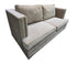 Angled view of used gray upholstered sleeper sofa with nailhead trim.