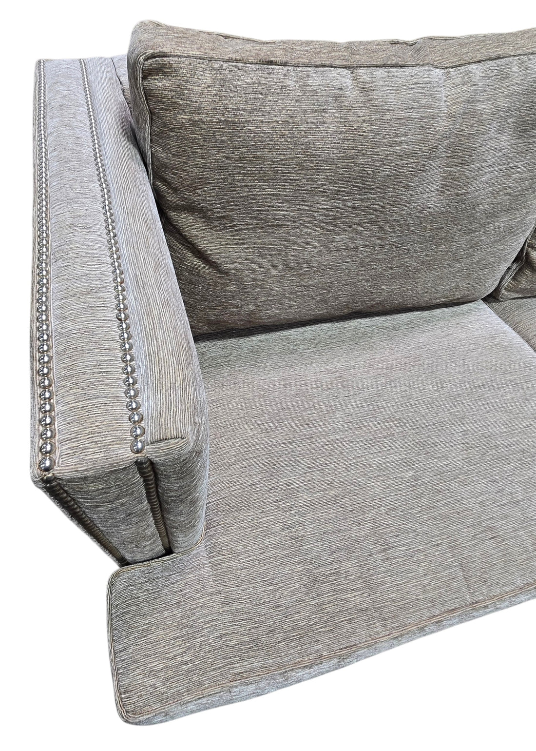 Close-up of nailhead trim and upholstery on used sleeper sofa