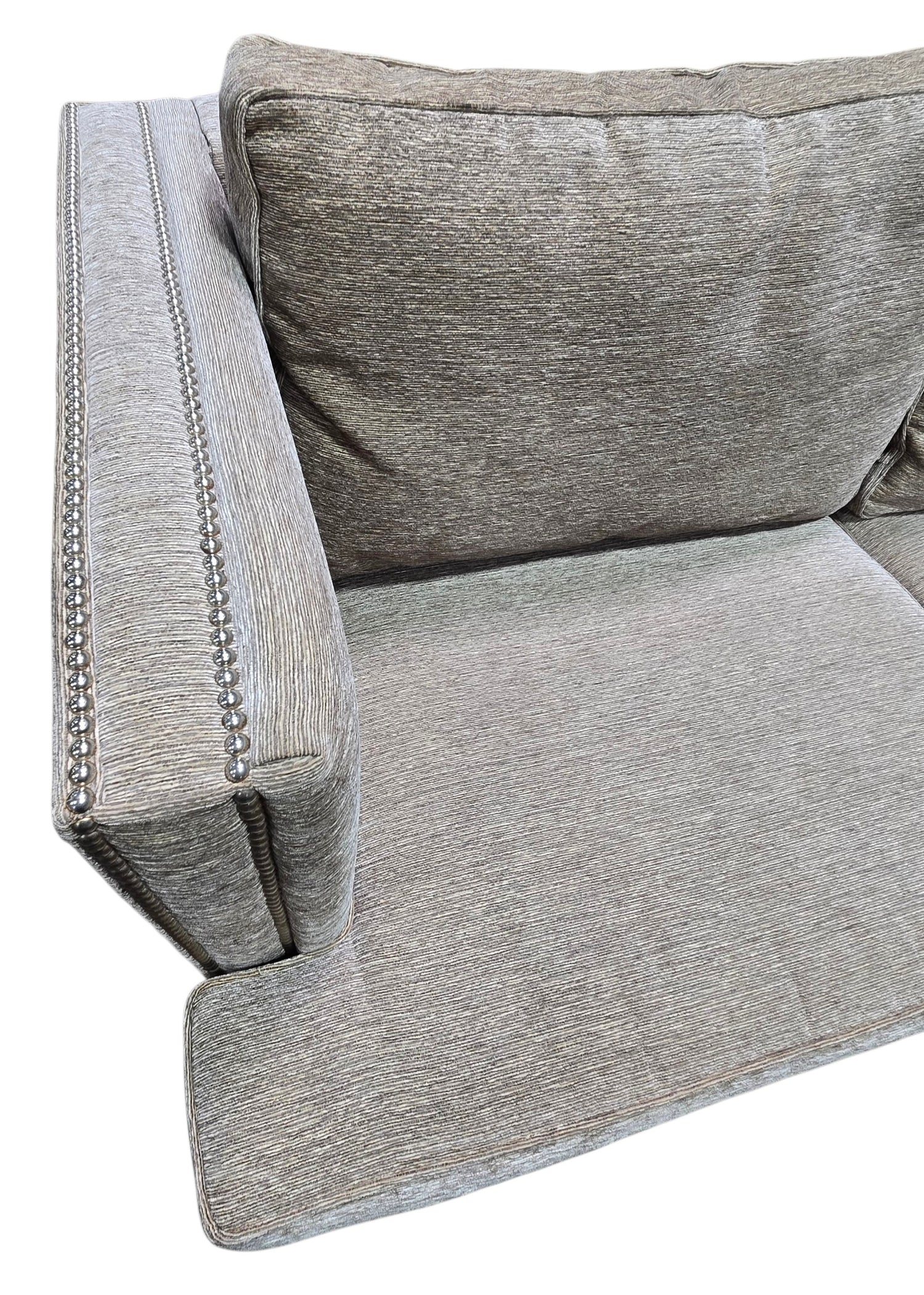 Close-up of nailhead trim and upholstery on used sleeper sofa
