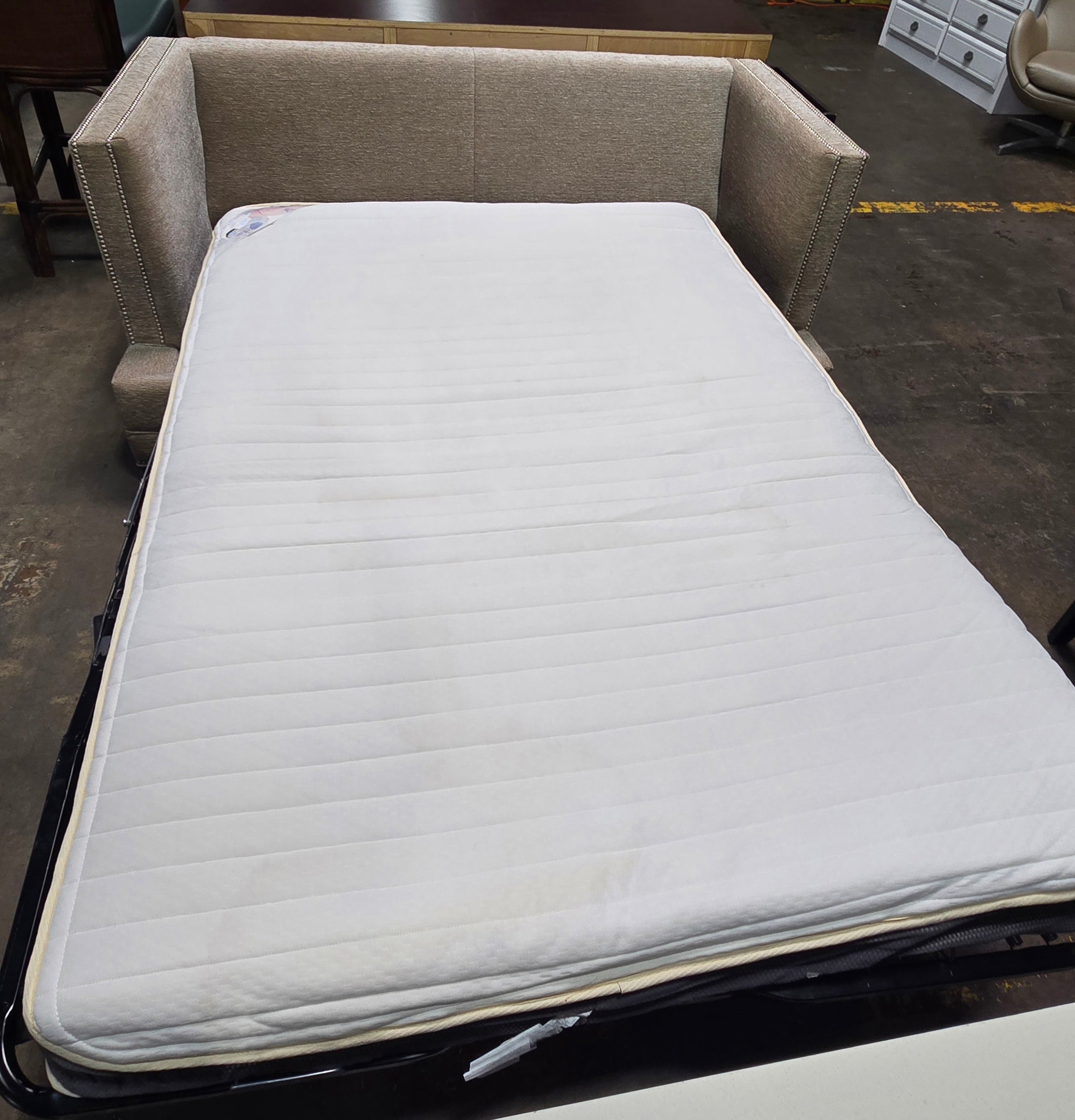 Used sleeper sofa opened to reveal Memory Gel mattress