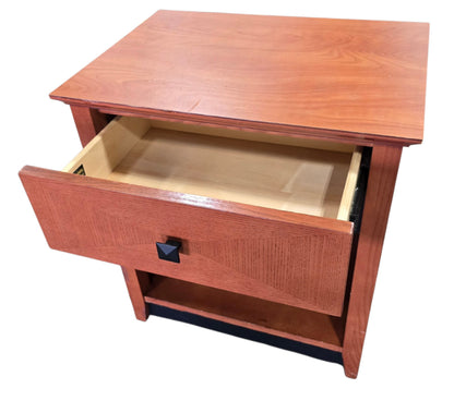 Used Kimball Hospitality nightstand with drawer extended to show storage space, quality used resort furniture at Southern Hospitality Liquidation.