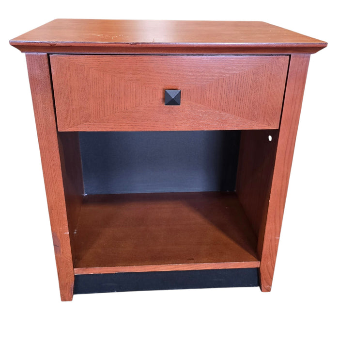 Used Kimball Hospitality wood nightstand with drawer and open shelf, front view, quality used resort furniture at Southern Hospitality Liquidation.