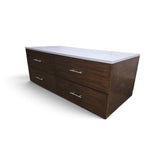 Angled view of a used modern dark wood 4 drawer dresser with white granite top from Southern Hospitality Liquidation