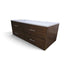 Angled view of a used modern dark wood 4 drawer dresser with white granite top from Southern Hospitality Liquidation