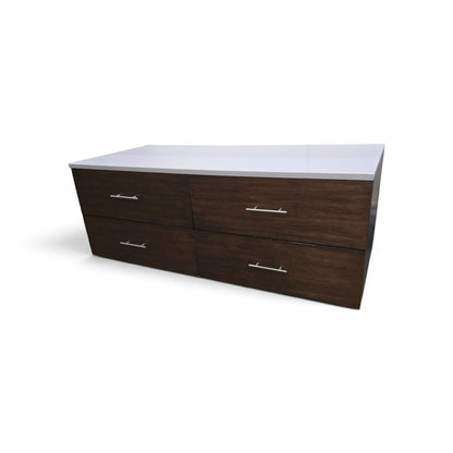 Used modern 4 drawer dresser with white granite top from Southern Hospitality Liquidation