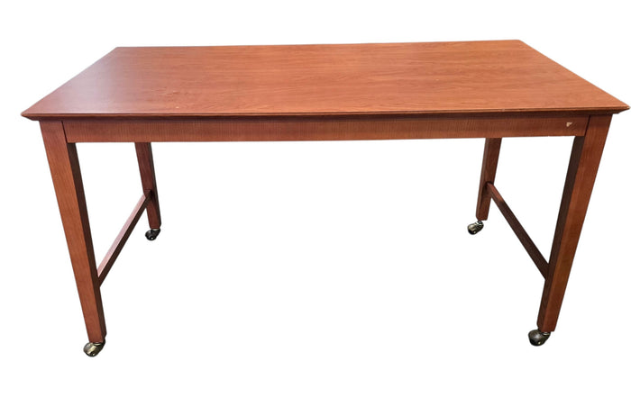 Used rolling wood writing desk with brass casters, front view, at Southern Hospitality Liquidation in Cartersville, GA.
