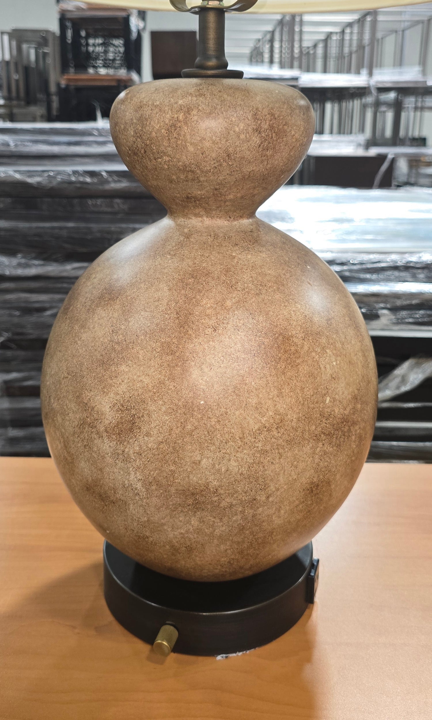 Close-up of the textured stone finish gourd-shaped base on a quality used resort table lamp available at Southern Hospitality Liquidation.