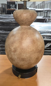 Close-up of the textured stone finish gourd-shaped base on a quality used resort table lamp available at Southern Hospitality Liquidation.