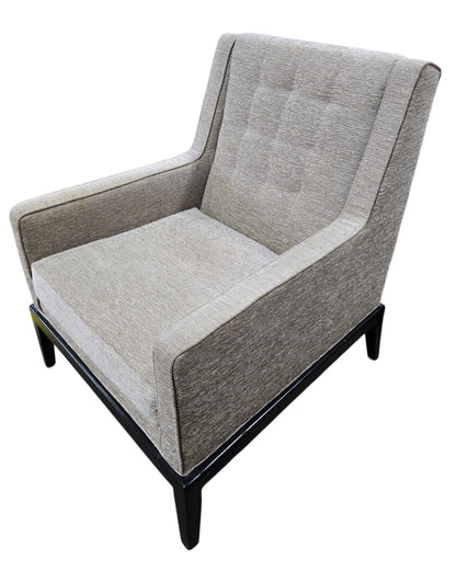 Used upholstered lounge accent chair with black wood base, angled view, quality used resort furniture at Southern Hospitality Liquidation.