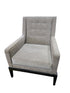 Used upholstered lounge accent chair with textured neutral fabric and black wood base, front view, at Southern Hospitality Liquidation.